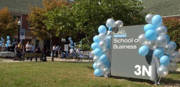 school of business sign and balloons