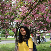 Yamin Outside Standing Under A  Tree