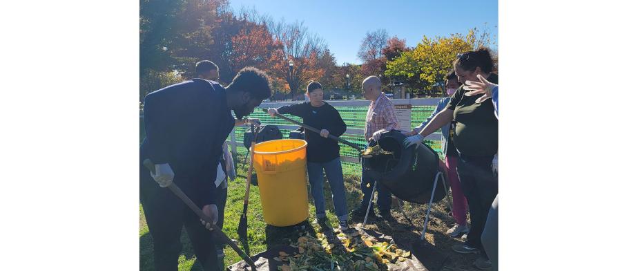 Group of people working with a compost