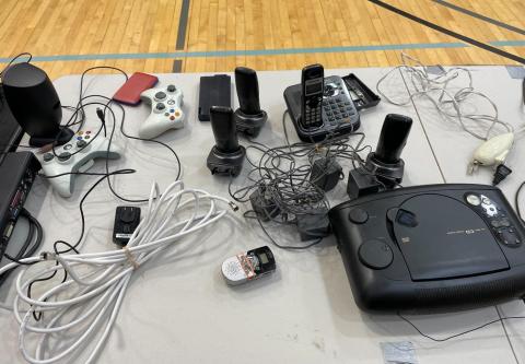 Table with electronics and video games systems