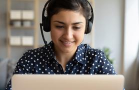 Female student viewing a laptop